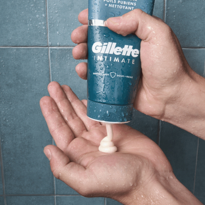 close-up of two hands, one pouring a product into the other